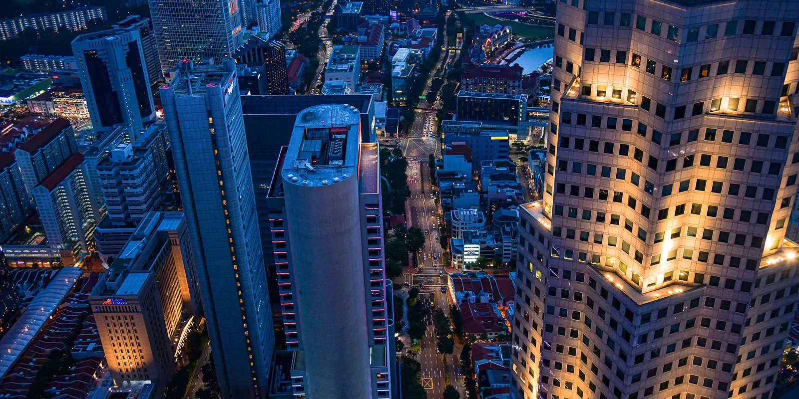 Aerial view of Singapore city street traffic and surrounding skyscrapers
